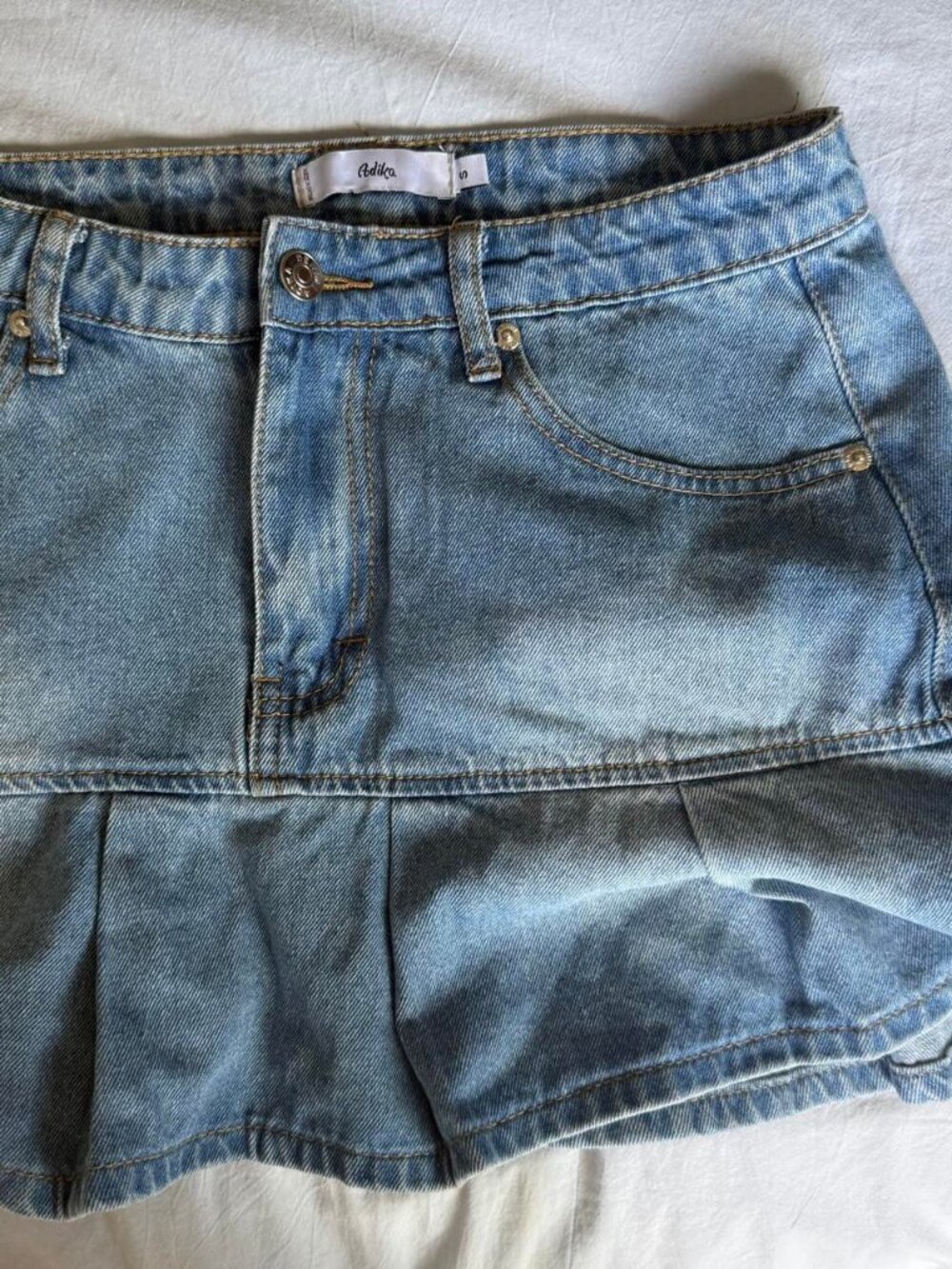 Adika blue denim mini skirt ruffle hem